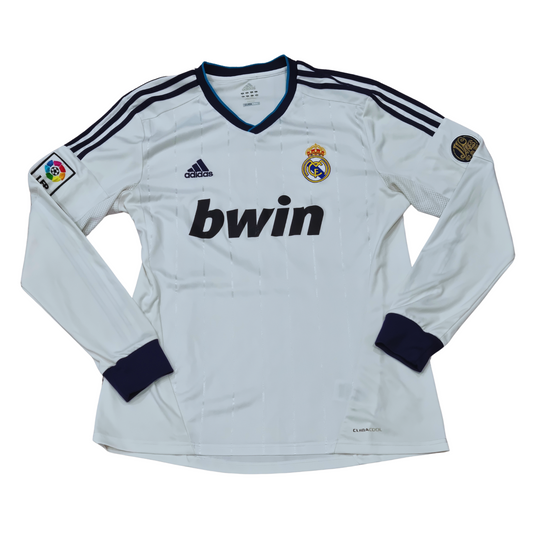 An Adidas Real Madrid 2012/13 home jersey with the word Real Madrid prominently displayed.