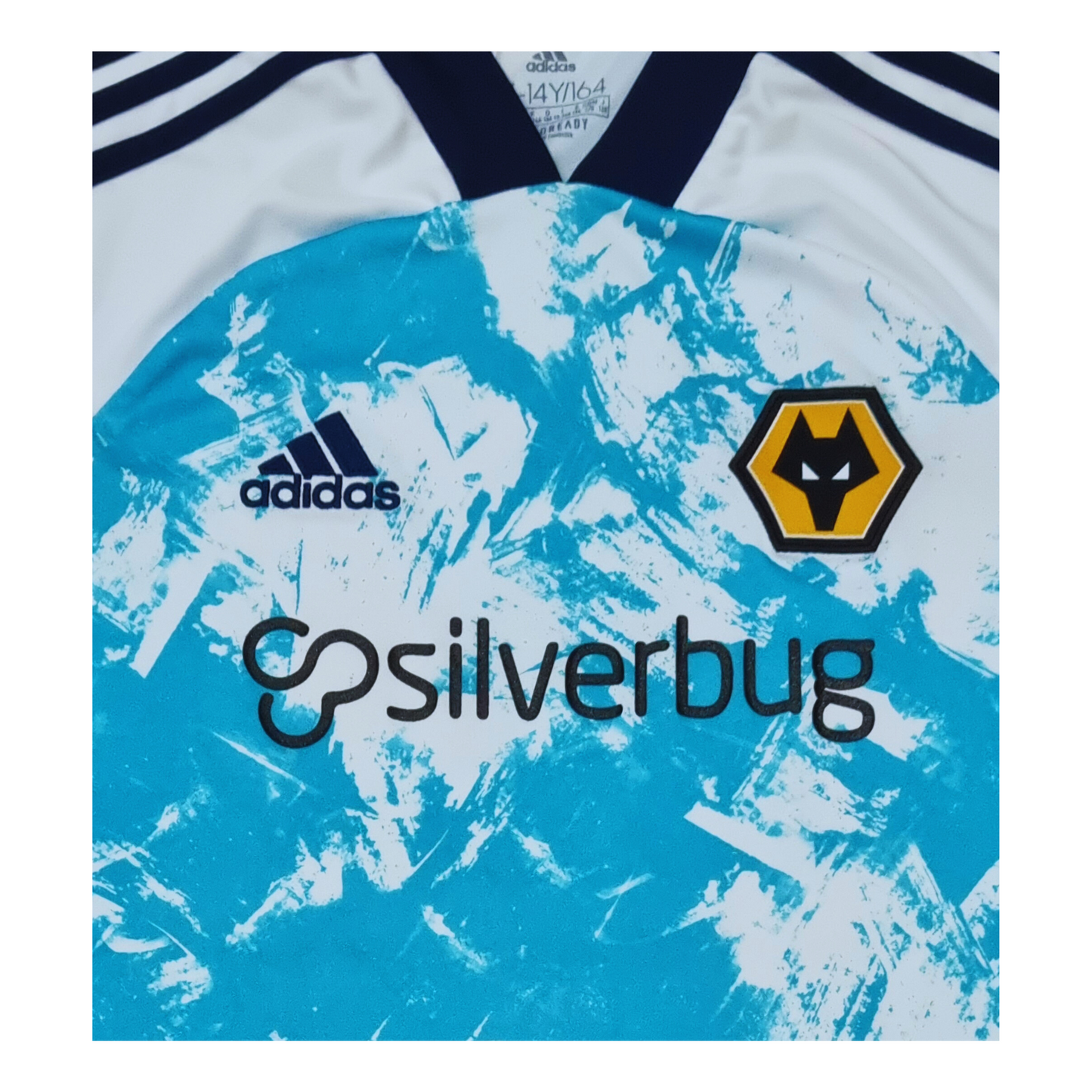 A blue and white Wolverhampton Wanderers 2020/21 Away Jersey with the words silverbug on it. (Adidas)