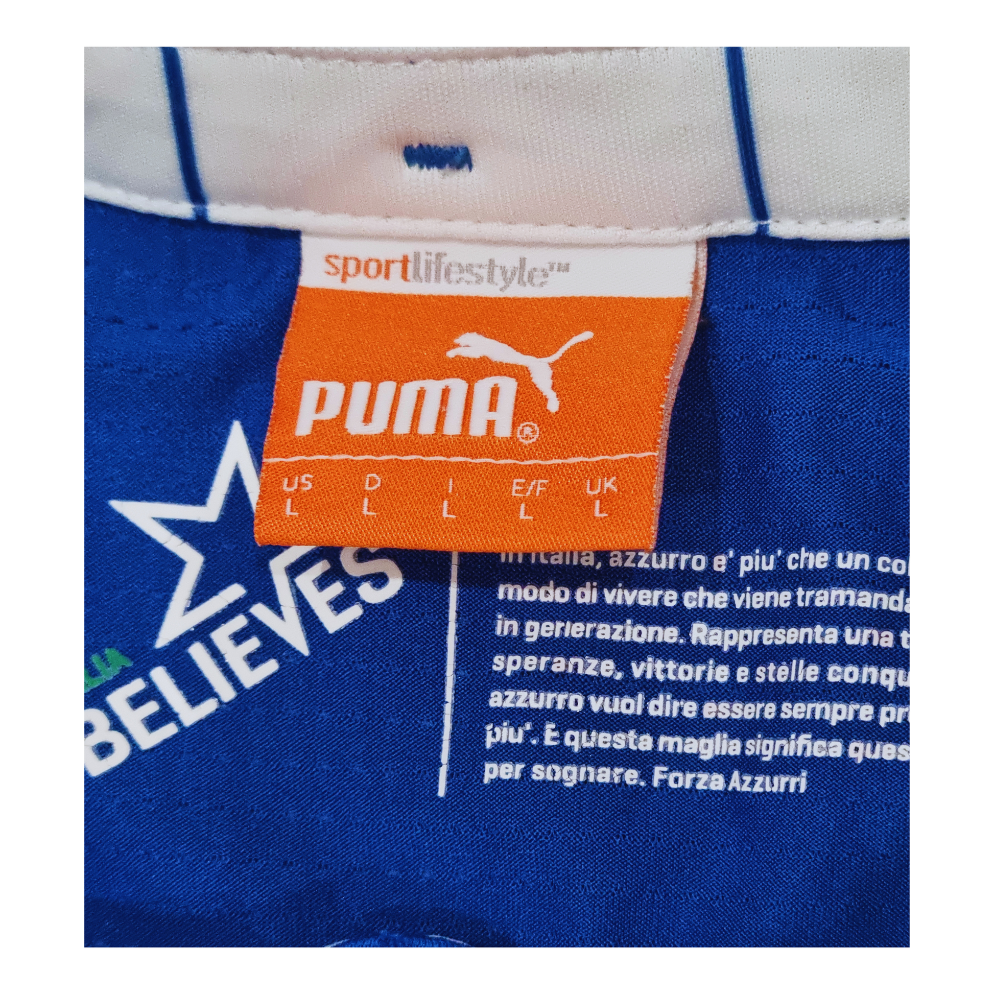 A vintage Puma Italy 2014 Home Jersey football shirt with a label on it, mens size large.