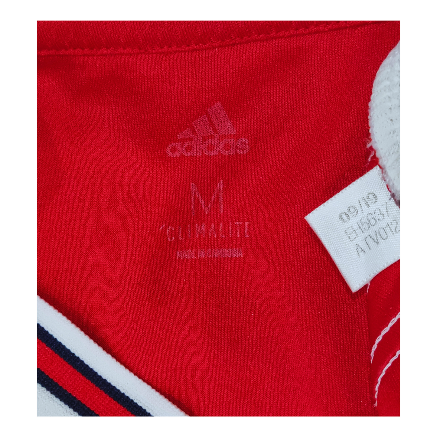 A pair of red Adidas shorts with an Arsenal 2019/20 Home Jersey label on them.