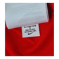 A red Nike England 2014 Away Jersey with a label on it, available in Small or Medium sizes.