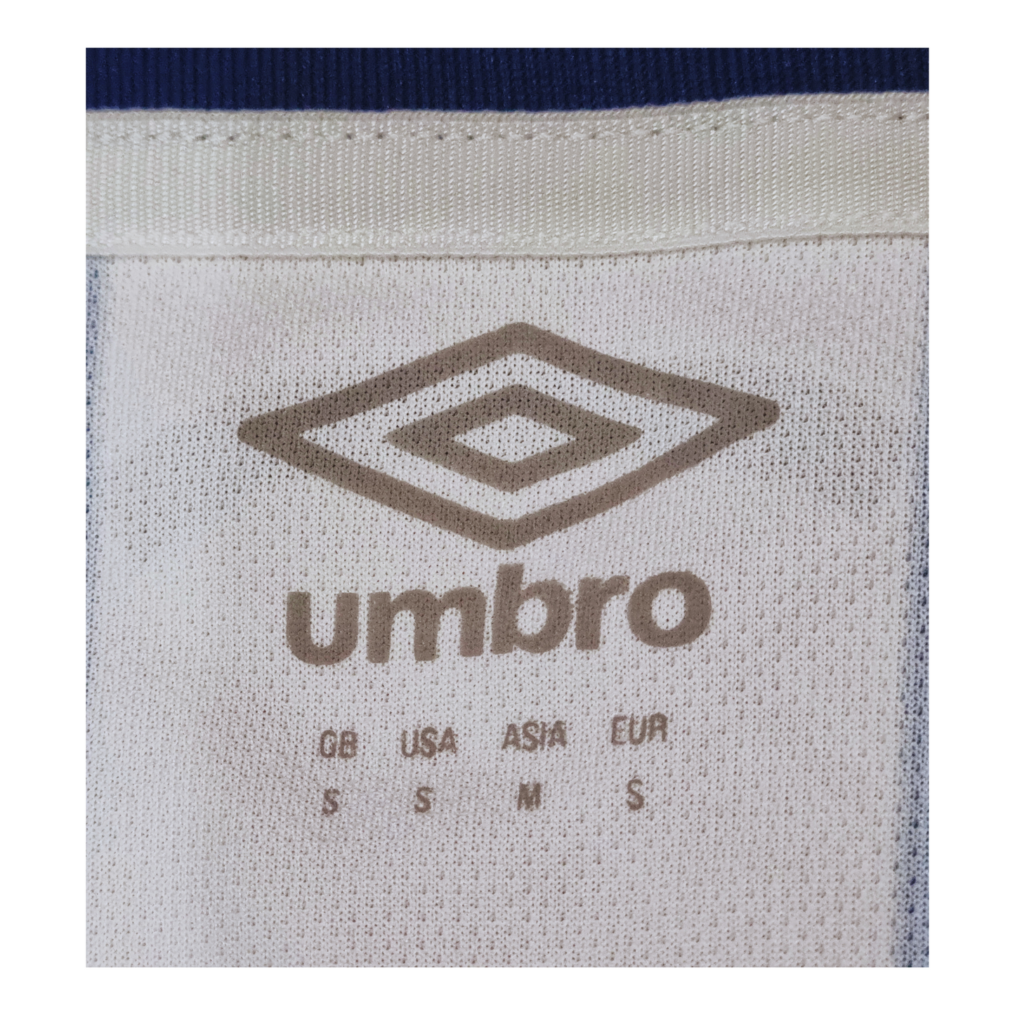 The back of a Huddersfield Town 2019/20 Home Jersey with the Umbro logo on it.