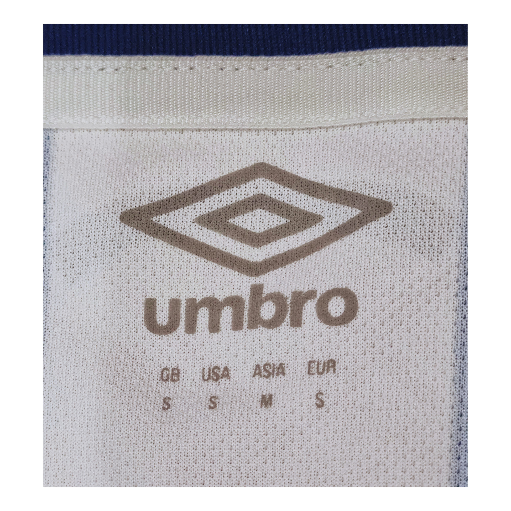 The back of a Huddersfield Town 2019/20 Home Jersey with the Umbro logo on it.