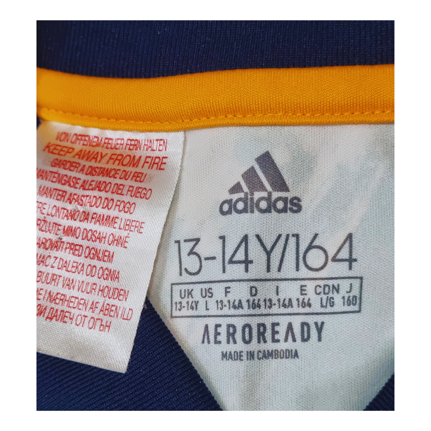 A label on the back of a blue and yellow Adidas Wolverhampton Wanderers 2020/21 Away Jersey.