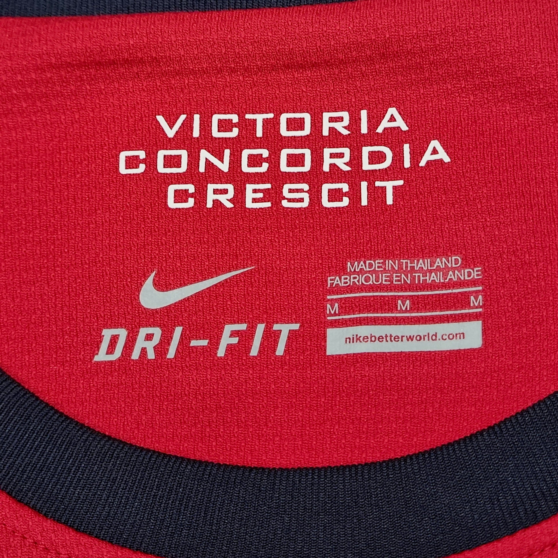 A red Nike Arsenal 2013/14 Home Jersey.
